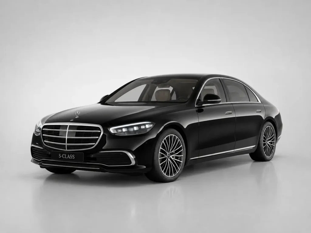 Black Mercedes-Benz S-Class luxury sedan on a plain studio background